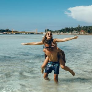 young-couple-posing-beach-having-fun-sea-laughing-smiling_1296-916.jpg Destination Dive